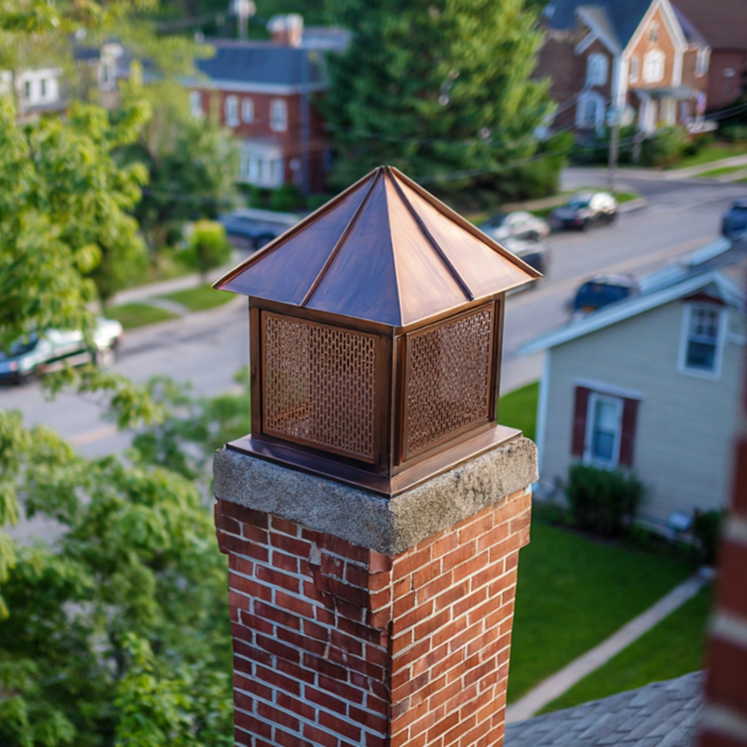 Copper chimney cap with pyramid silhouette for historic building chimneys
