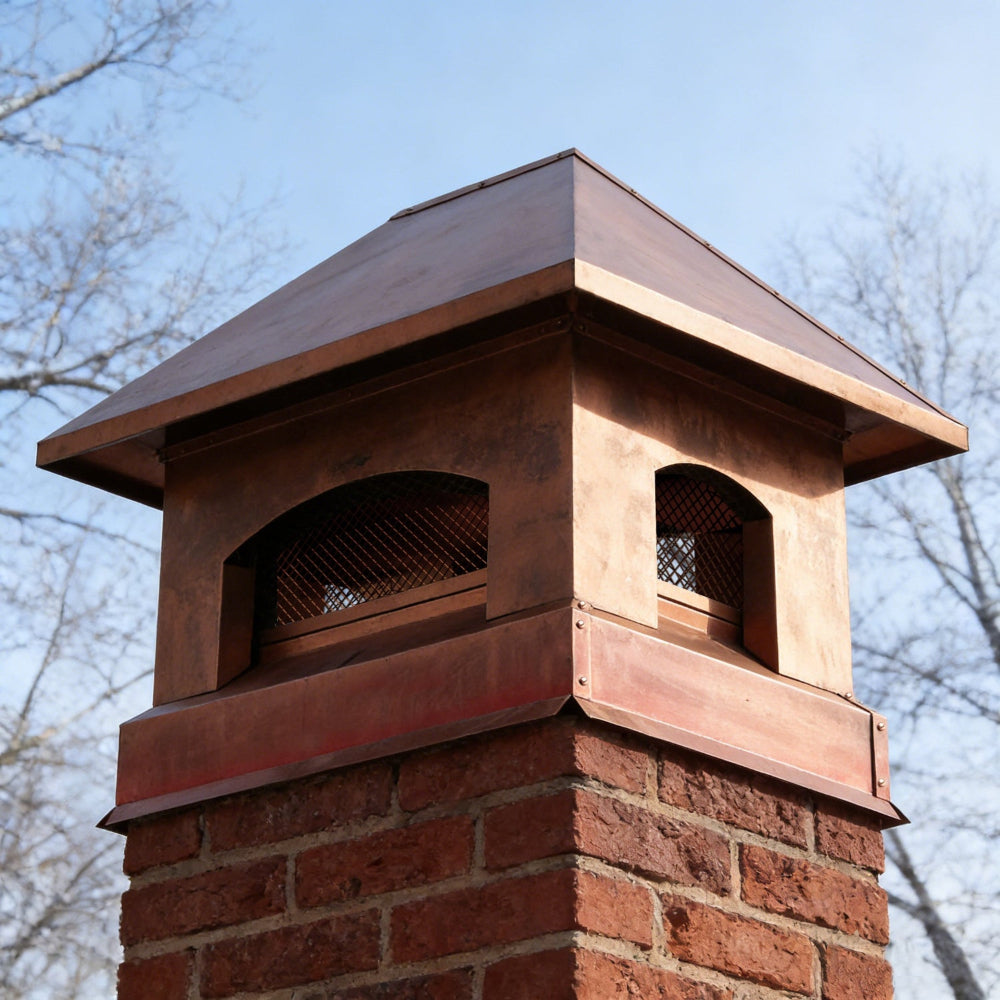 custom copper chimney cap pyramid shape in nature copper color with protective mesh and overhang at chimneycapmaster